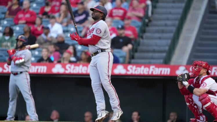 May 7, 2022; Anaheim, California, USA; Washington Nationals first baseman Josh Bell (19) follows through on a solo home run against the Los Angeles Angels in the first inning at Angel Stadium. Mandatory Credit: Kirby Lee-USA TODAY Sports