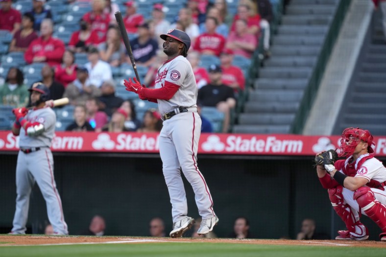 May 7, 2022; Anaheim, California, USA; Washington Nationals first baseman Josh Bell (19) follows through on a solo home run against the Los Angeles Angels in the first inning at Angel Stadium. Mandatory Credit: Kirby Lee-USA TODAY Sports