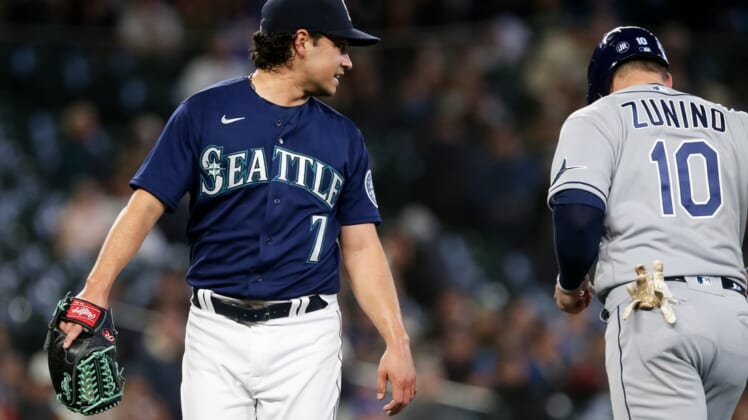 May 7, 2022; Seattle, Washington, USA;  Seattle Mariners starting pitcher Marco Gonzales (7) looks back to talk to former teammate and current Tampa Bay Rays catcher Mike Zunino (10) after the second inning at T-Mobile Park. Mandatory Credit: Lindsey Wasson-USA TODAY Sports