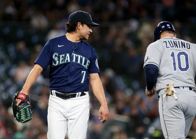 May 7, 2022; Seattle, Washington, USA;  Seattle Mariners starting pitcher Marco Gonzales (7) looks back to talk to former teammate and current Tampa Bay Rays catcher Mike Zunino (10) after the second inning at T-Mobile Park. Mandatory Credit: Lindsey Wasson-USA TODAY Sports