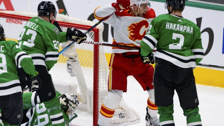 May 7, 2022; Dallas, Texas, USA; Calgary Flames center Trevor Lewis (22) celebrates scoring against Dallas Stars goaltender Jake Oettinger (29) during the first period in game three of the first round of the 2022 Stanley Cup Playoffs at American Airlines Center. Mandatory Credit: Jerome Miron-USA TODAY Sports