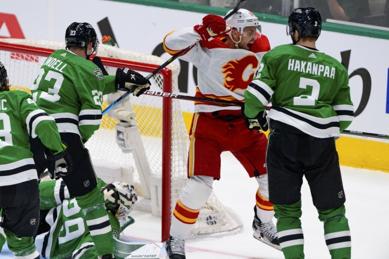 May 7, 2022; Dallas, Texas, USA; Calgary Flames center Trevor Lewis (22) celebrates scoring against Dallas Stars goaltender Jake Oettinger (29) during the first period in game three of the first round of the 2022 Stanley Cup Playoffs at American Airlines Center. Mandatory Credit: Jerome Miron-USA TODAY Sports