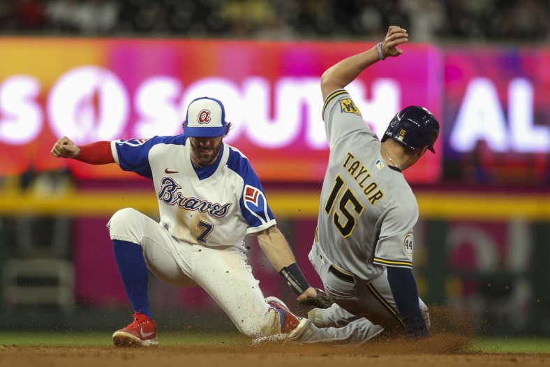 May 7, 2022; Atlanta, Georgia, USA; Atlanta Braves shortstop Dansby Swanson (7) tags out Milwaukee Brewers left fielder Tyrone Taylor (15) to end the game at Truist Park. Mandatory Credit: Brett Davis-USA TODAY Sports