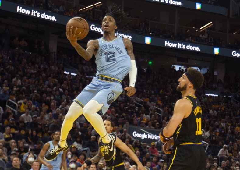 May 7, 2022; San Francisco, California, USA; Memphis Grizzlies guard Ja Morant (12) drives to the basket against Golden State Warriors guard Klay Thompson (11) during the third quarter of game three of the second round for the 2022 NBA playoffs at Chase Center. Mandatory Credit: D. Ross Cameron-USA TODAY Sports