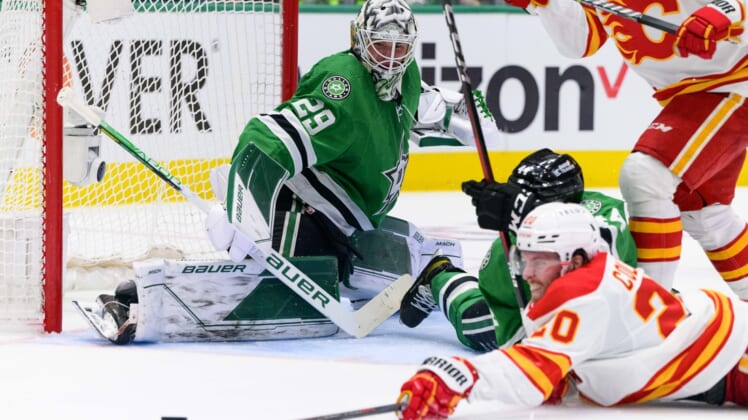 May 7, 2022; Dallas, Texas, USA; Dallas Stars goaltender Jake Oettinger (29) and defenseman Joel Hanley (44) defend against Calgary Flames center Blake Coleman (20) during the second period in game three of the first round of the 2022 Stanley Cup Playoffs at American Airlines Center. Mandatory Credit: Jerome Miron-USA TODAY Sports
