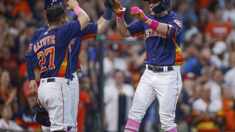 May 8, 2022; Houston, Texas, USA; Houston Astros shortstop Aledmys Diaz (16) celebrates with teammates after hitting a grand slam home run during the third inning against the Detroit Tigers at Minute Maid Park. Mandatory Credit: Troy Taormina-USA TODAY Sports