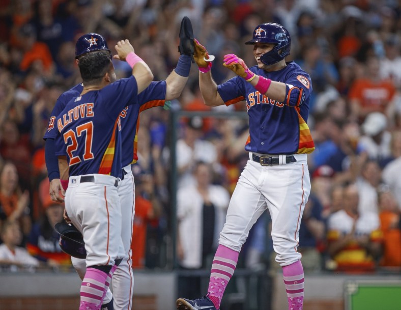 May 8, 2022; Houston, Texas, USA; Houston Astros shortstop Aledmys Diaz (16) celebrates with teammates after hitting a grand slam home run during the third inning against the Detroit Tigers at Minute Maid Park. Mandatory Credit: Troy Taormina-USA TODAY Sports