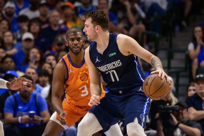 May 8, 2022; Dallas, Texas, USA; Phoenix Suns guard Chris Paul (3) guards Dallas Mavericks guard Luka Doncic (77) during the second quarter during game four of the second round for the 2022 NBA playoffs at American Airlines Center. Mandatory Credit: Jerome Miron-USA TODAY Sports