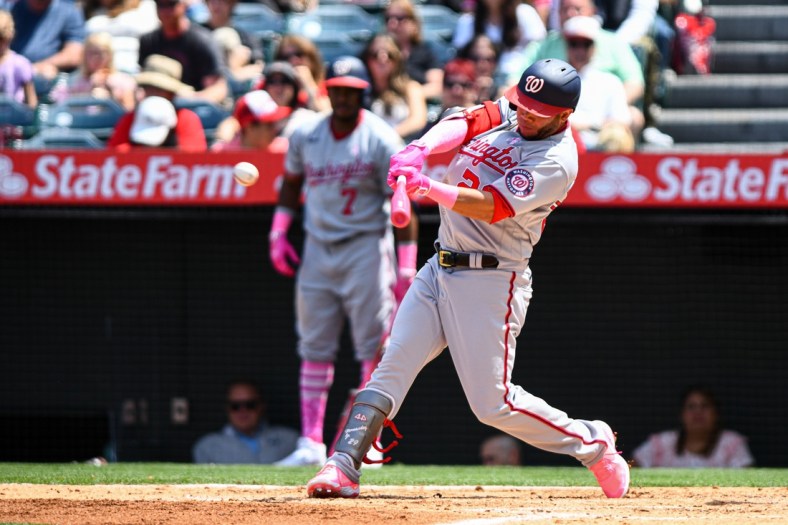 May 8, 2022; Anaheim, California, USA;  Washington Nationals left fielder Yadiel Hernandez (29) hits a single against the Los Angeles Angels during the fourth inning at Angel Stadium. Mandatory Credit: Jonathan Hui-USA TODAY Sports