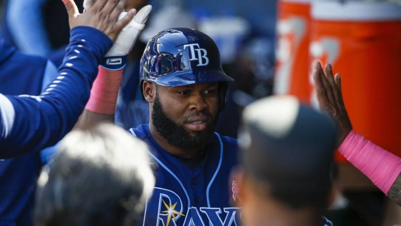 May 8, 2022; Seattle, Washington, USA; Tampa Bay Rays right fielder Manuel Margot (13) exchanges high fives in the dugout after hitting a solo home run against the Seattle Mariners during the eighth inning at T-Mobile Park. Mandatory Credit: Joe Nicholson-USA TODAY Sports