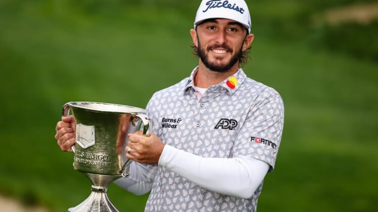 May 8, 2022; Potomac, Maryland, USA; Max Homa holds the Championship Trophy after winning the Wells Fargo Championship golf tournament. Mandatory Credit: Scott Taetsch-USA TODAY Sports