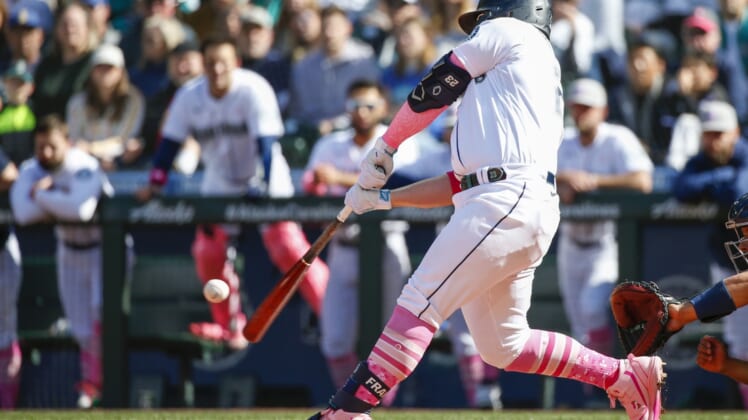 May 8, 2022; Seattle, Washington, USA; Seattle Mariners first baseman Ty France (23) hits a walk-off RBI-single against the Tampa Bay Rays during the tenth inning at T-Mobile Park. Mandatory Credit: Joe Nicholson-USA TODAY Sports
