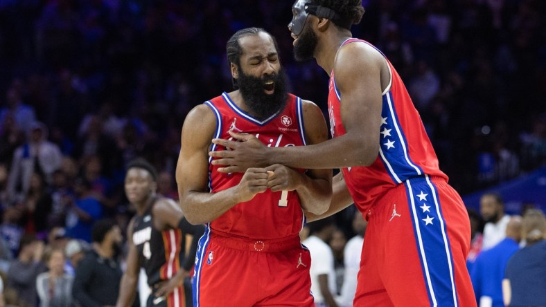 May 8, 2022; Philadelphia, Pennsylvania, USA; Philadelphia 76ers guard James Harden (1) reacts with center Joel Embiid (21) after a score against the Miami Heat during the second quarter in game four of the second round for the 2022 NBA playoffs at Wells Fargo Center. Mandatory Credit: Bill Streicher-USA TODAY Sports