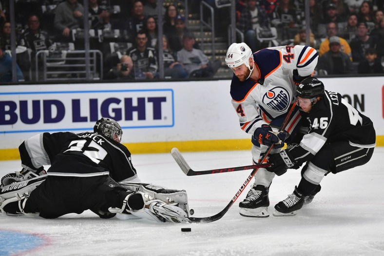 May 8, 2022; Los Angeles, California, USA; Los Angeles Kings center Blake Lizotte (46) helps goaltender Jonathan Quick (32) defend the goal against Edmonton Oilers right wing Zack Kassian (44) during the first period in game four of the first round of the 2022 Stanley Cup Playoffs at Crypto.com Arena. Mandatory Credit: Gary A. Vasquez-USA TODAY Sports
