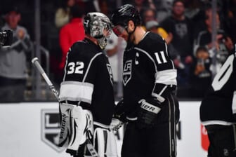 May 8, 2022; Los Angeles, California, USA; Los Angeles Kings goaltender Jonathan Quick (32) and center Anze Kopitar (11) celebrate the victory against the Edmonton Oilers following game four of the first round of the 2022 Stanley Cup Playoffs at Crypto.com Arena. Mandatory Credit: Gary A. Vasquez-USA TODAY Sports