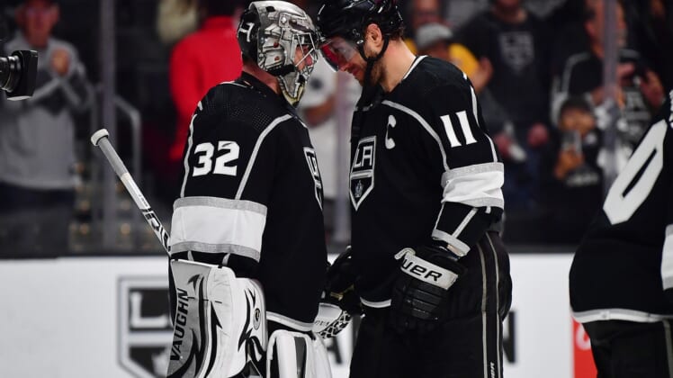 May 8, 2022; Los Angeles, California, USA; Los Angeles Kings goaltender Jonathan Quick (32) and center Anze Kopitar (11) celebrate the victory against the Edmonton Oilers following game four of the first round of the 2022 Stanley Cup Playoffs at Crypto.com Arena. Mandatory Credit: Gary A. Vasquez-USA TODAY Sports