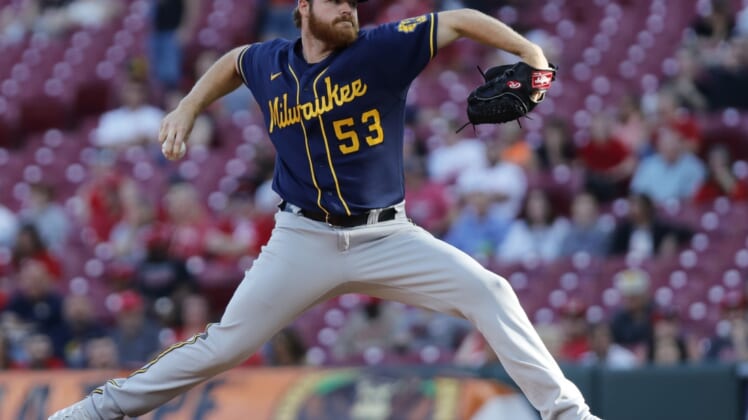 May 9, 2022; Cincinnati, Ohio, USA; Milwaukee Brewers starting pitcher Brandon Woodruff (53) throws a pitch against the Cincinnati Reds during the first inning at Great American Ball Park. Mandatory Credit: David Kohl-USA TODAY Sports