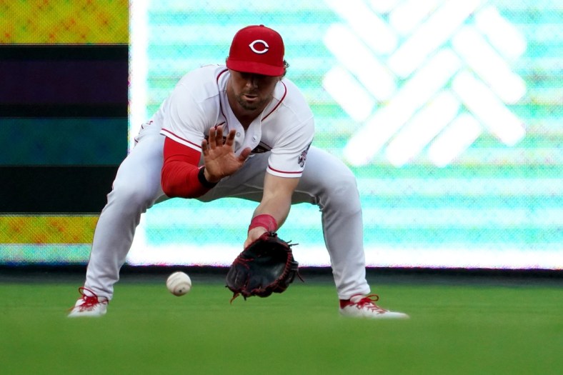 Cincinnati Reds shortstop Kyle Farmer (17) fields a groundball in the fourth inning of a baseball game against the Milwaukee Brewers, Monday, May 9, 2022, at Great American Ball Park in Cincinnati.

Milwaukee Brewers At Cincinnati Reds May 9 0035