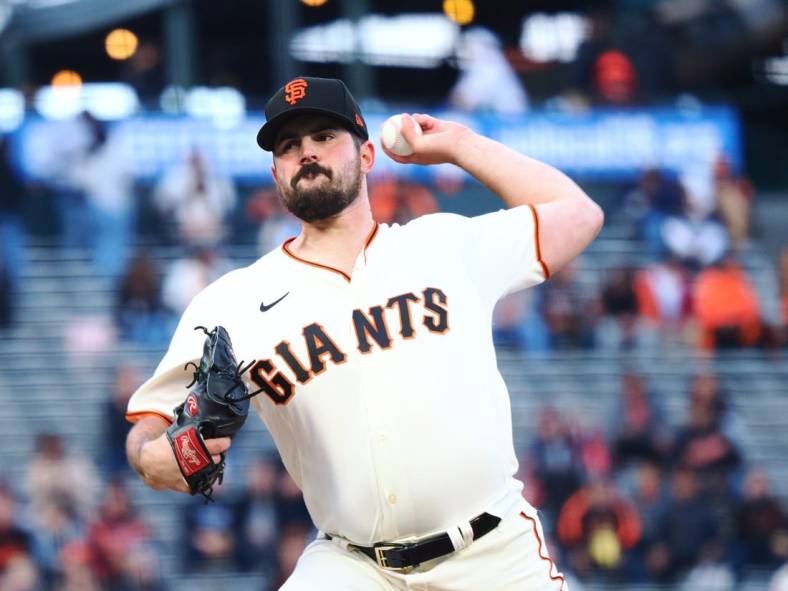 May 9, 2022; San Francisco, California, USA; San Francisco Giants starting pitcher Carlos Rodon (16) pitches the ball against the Colorado Rockies during the first inning at Oracle Park. Mandatory Credit: Kelley L Cox-USA TODAY Sports