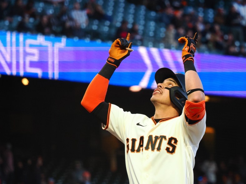 May 9, 2022; San Francisco, California, USA; San Francisco Giants center fielder Mauricio Dubon (1) gestures as he crosses the plate on a two-run home run against the Colorado Rockies during the third inning at Oracle Park. Mandatory Credit: Kelley L Cox-USA TODAY Sports