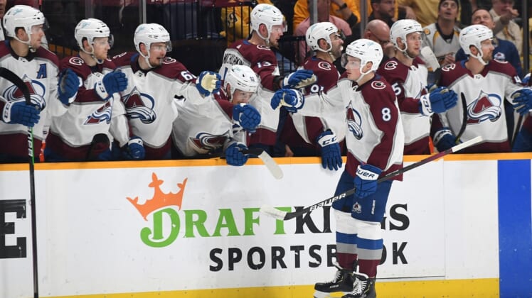 May 9, 2022; Nashville, Tennessee, USA; Colorado Avalanche defenseman Cale Makar (8) is congratulated by teammates after a goal during the second period against the Nashville Predators in game four of the first round of the 2022 Stanley Cup Playoffs at Bridgestone Arena. Mandatory Credit: Christopher Hanewinckel-USA TODAY Sports