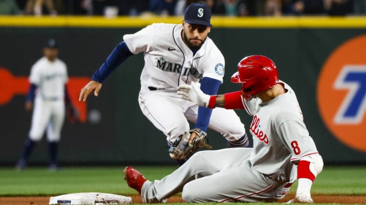 May 9, 2022; Seattle, Washington, USA; Philadelphia Phillies right fielder Nick Castellanos (8) slides into second base for a double before Seattle Mariners second baseman Abraham Toro (13) can apply a tag during the third inning at T-Mobile Park. Mandatory Credit: Joe Nicholson-USA TODAY Sports
