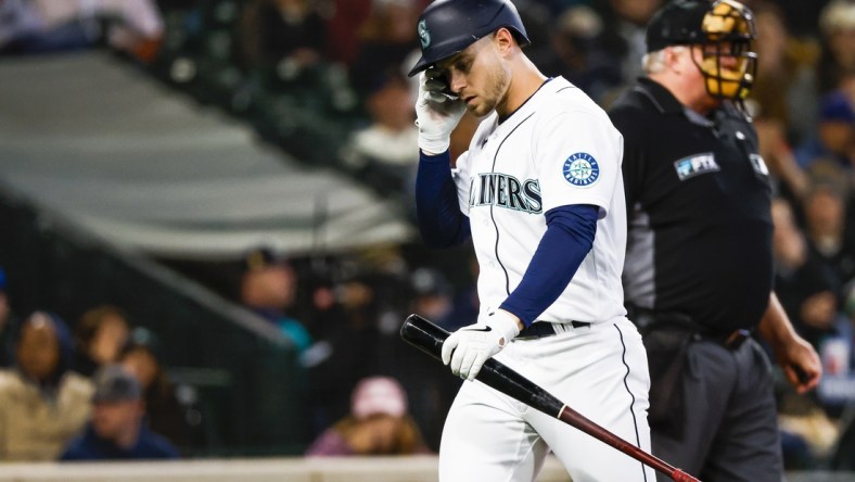 May 9, 2022; Seattle, Washington, USA; Seattle Mariners right fielder Jarred Kelenic (10) returns to the dugout after striking out against the Philadelphia Phillies during the second inning at T-Mobile Park. Mandatory Credit: Joe Nicholson-USA TODAY Sports