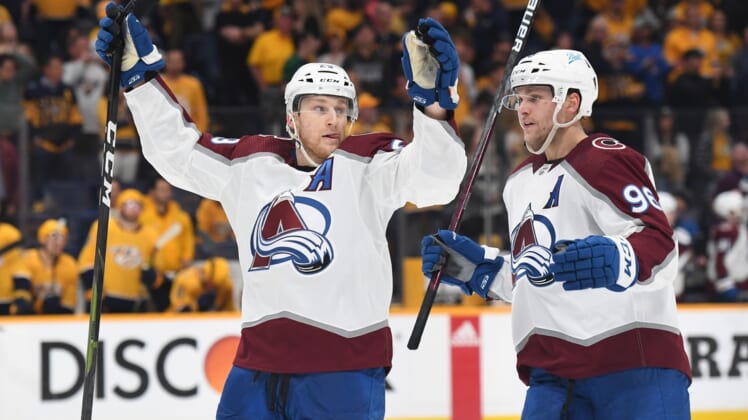 May 9, 2022; Nashville, Tennessee, USA; Colorado Avalanche center Nathan MacKinnon (29) and right wing Mikko Rantanen (96) celebrate after a goal during the third period against the Nashville Predators in game four of the first round of the 2022 Stanley Cup Playoffs at Bridgestone Arena. Mandatory Credit: Christopher Hanewinckel-USA TODAY Sports