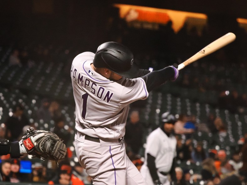 May 9, 2022; San Francisco, California, USA; Colorado Rockies center fielder Garrett Hampson (1) hits a ground rule double against the San Francisco Giants during the ninth inning at Oracle Park. Mandatory Credit: Kelley L Cox-USA TODAY Sports