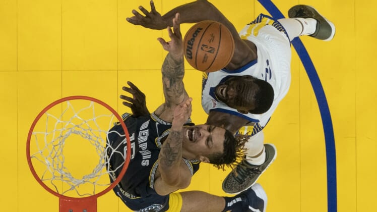 May 9, 2022; San Francisco, California, USA; Memphis Grizzlies forward Brandon Clarke (15) fights for the rebound against Golden State Warriors forward Draymond Green (23) during the second half of game four of the second round for the 2022 NBA playoffs at Chase Center. Mandatory Credit: Kyle Terada-USA TODAY Sports