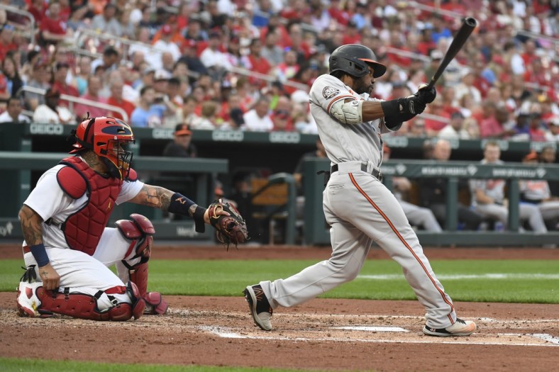 May 10, 2022; St. Louis, Missouri, USA; Baltimore Orioles center fielder Cedric Mullins (31) hits a two-run home run in the third inning against the St. Louis Cardinals at Busch Stadium. Mandatory Credit: Jeff Le-USA TODAY Sports