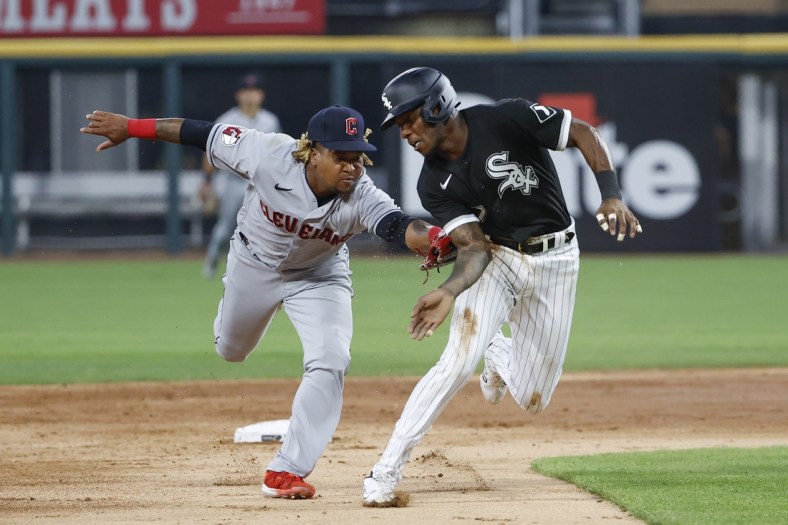 May 10, 2022; Chicago, Illinois, USA; Cleveland Guardians third baseman Jose Ramirez (11) tags out Chicago White Sox shortstop Tim Anderson (7) as he tries to steal third base during the third inning at Guaranteed Rate Field. Mandatory Credit: Kamil Krzaczynski-USA TODAY Sports