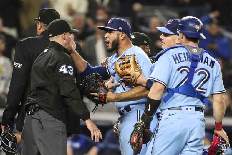May 10, 2022; Bronx, New York, USA;  Toronto Blue Jays relief pitcher Yimi Garcia (93) argues with umpire Shane Livensparger (43) after being ejected in the sixth inning against the New York Yankees at Yankee Stadium. Mandatory Credit: Wendell Cruz-USA TODAY Sports