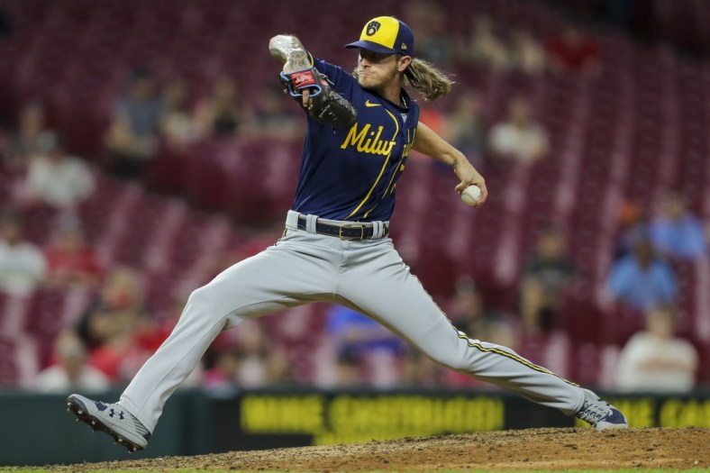 May 10, 2022; Cincinnati, Ohio, USA; Milwaukee Brewers relief pitcher Josh Hader (71) pitches against the Cincinnati Reds in the ninth inning at Great American Ball Park. Mandatory Credit: Katie Stratman-USA TODAY Sports