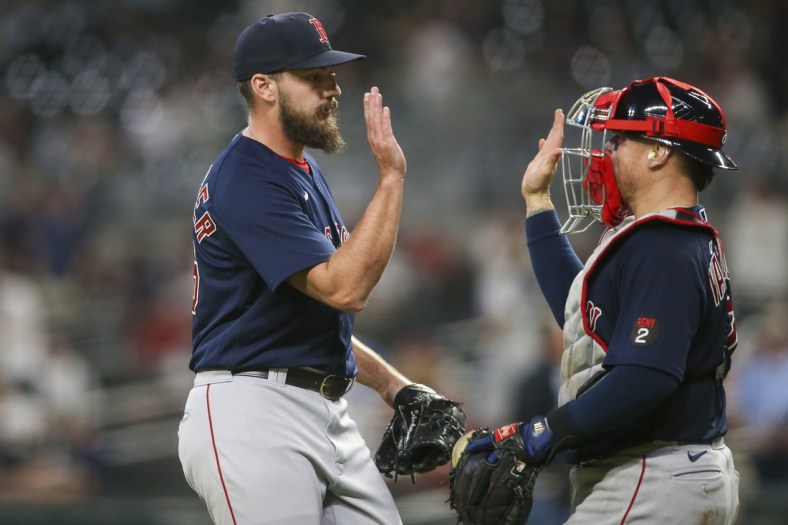 May 10, 2022; Atlanta, Georgia, USA; Boston Red Sox relief pitcher John Schreiber (46) celebrates with catcher Christian Vazquez (7) after a victory against the Atlanta Braves at Truist Park. Mandatory Credit: Brett Davis-USA TODAY Sports