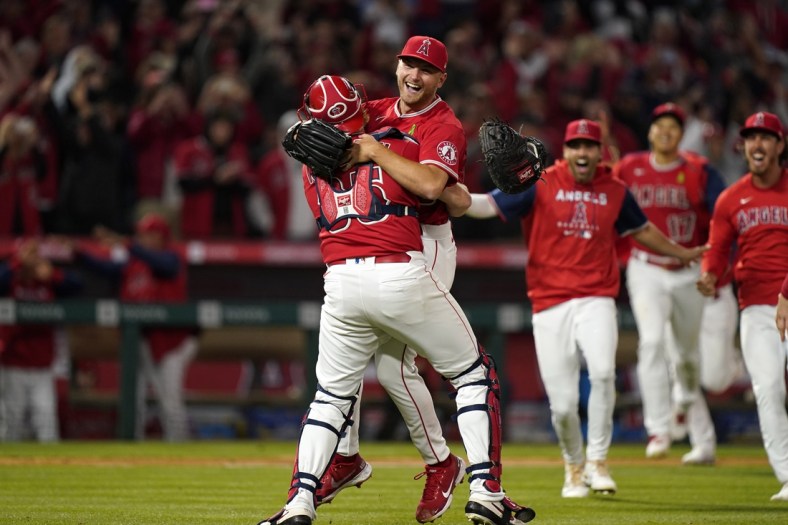 May 10, 2022; Anaheim, California, USA; Los Angeles Angels starting pitcher Reid Detmers (48) celebrates with catcher Chad Wallach (35) after throwing a no hitter against the Tampa Bay Rays at Angel Stadium. Mandatory Credit: Kirby Lee-USA TODAY Sports
