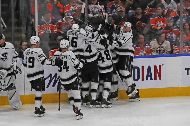 May 10, 2022; Edmonton, Alberta, CAN; Los Angeles Kings players celebrate a goal by forward Adrian Kempe (9) against the Edmonton Oilers during overtime in game five of the first round of the 2022 Stanley Cup Playoffs at Rogers Place. Mandatory Credit: Perry Nelson-USA TODAY Sports