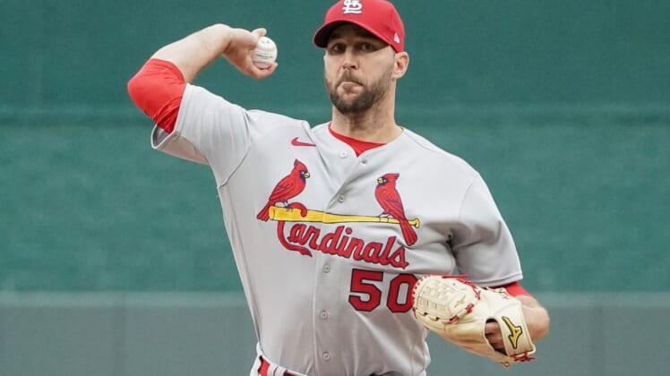 May 4, 2022; Kansas City, Missouri, USA; St. Louis Cardinals starting pitcher Adam Wainwright (50) delivers a warm up pitch in between innings against the Kansas City Royals during the game at Kauffman Stadium. Mandatory Credit: Denny Medley-USA TODAY Sports
