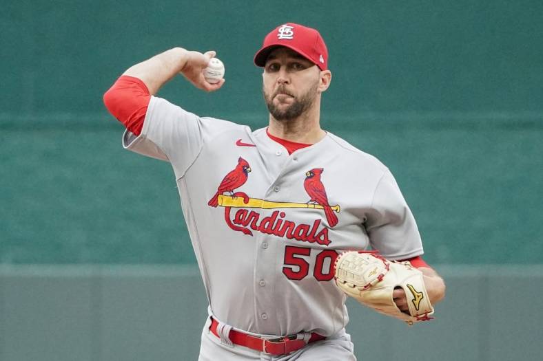 May 4, 2022; Kansas City, Missouri, USA; St. Louis Cardinals starting pitcher Adam Wainwright (50) delivers a warm up pitch in between innings against the Kansas City Royals during the game at Kauffman Stadium. Mandatory Credit: Denny Medley-USA TODAY Sports