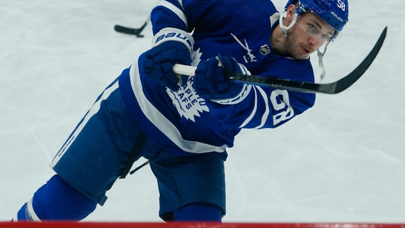 May 4, 2022; Toronto, Ontario, CAN; Toronto Maple Leafs forward Michael Bunting (58) shoots the puck during warm up before game two of the first round of the 2022 Stanley Cup Playoffs against the Tampa Bay Lightning at Scotiabank Arena. Mandatory Credit: John E. Sokolowski-USA TODAY Sports