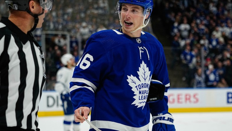 May 4, 2022; Toronto, Ontario, CAN; Toronto Maple Leafs forward Mitchell Marner (16) talks to referee Gord Dwyer(19) in game two of the first round of the 2022 Stanley Cup Playoffs against the Tampa Bay Lightning at Scotiabank Arena. Mandatory Credit: John E. Sokolowski-USA TODAY Sports