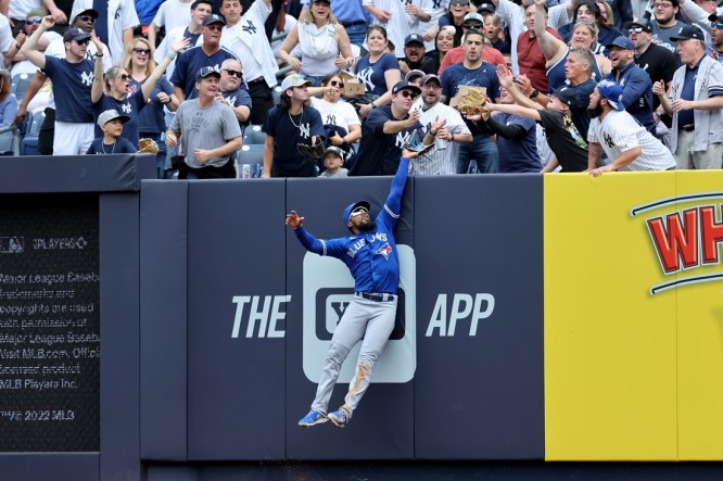 May 11, 2022; Bronx, New York, USA; Toronto Blue Jays right fielder Teoscar Hernandez (37) can't catch a three run home run by New York Yankees second baseman Gleyber Torres (not pictured) during the fourth inning at Yankee Stadium. Mandatory Credit: Brad Penner-USA TODAY Sports
