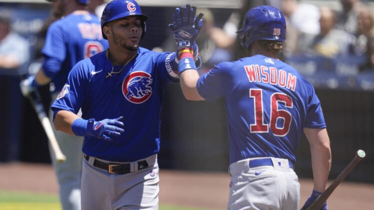 May 11, 2022; San Diego, California, USA; Chicago Cubs left fielder Ian Happ (8) is congratulated by Patrick Wisdom (16) after his home run during the first inning against the San Diego Padres at Petco Park. Mandatory Credit: Ray Acevedo-USA TODAY Sports