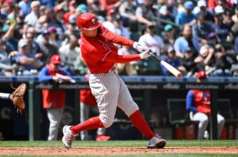 May 11, 2022; Seattle, Washington, USA; Philadelphia Phillies first baseman Rhys Hoskins (17) hits a double against the Seattle Mariners during the sixth inning at T-Mobile Park. Mandatory Credit: Steven Bisig-USA TODAY Sports