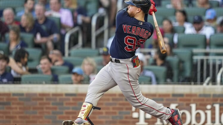 May 11, 2022; Cumberland, Georgia, USA; Boston Red Sox left fielder Alex Verdugo (99) hits a double before scoring against the Atlanta Braves during the second inning at Truist Park. Mandatory Credit: Dale Zanine-USA TODAY Sports