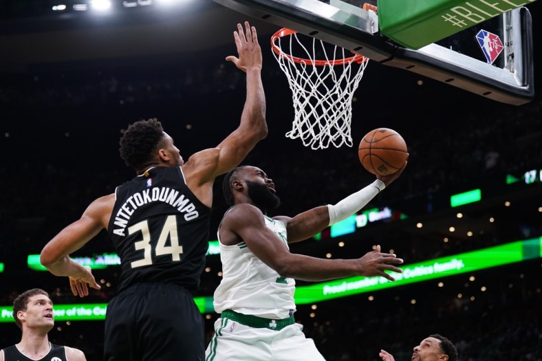 May 11, 2022; Boston, Massachusetts, USA; Boston Celtics guard Jaylen Brown (7) shoots against Milwaukee Bucks forward Giannis Antetokounmpo (34) in the second quarter during game five of the second round for the 2022 NBA playoffs at TD Garden. Mandatory Credit: David Butler II-USA TODAY Sports
