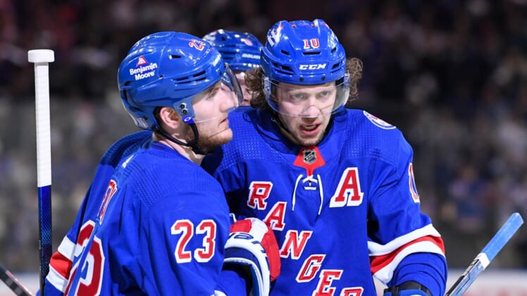 May 11, 2022; New York, New York, USA; New York Rangers left wing Artemi Panarin (10) celebrates the goal by New York Rangers defenseman Adam Fox (23) against the Pittsburgh Penguins during the second period in game five of the first round of the 2022 Stanley Cup Playoffs at Madison Square Garden. Mandatory Credit: Dennis Schneidler-USA TODAY Sports
