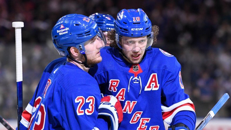 May 11, 2022; New York, New York, USA; New York Rangers left wing Artemi Panarin (10) celebrates the goal by New York Rangers defenseman Adam Fox (23) against the Pittsburgh Penguins during the second period in game five of the first round of the 2022 Stanley Cup Playoffs at Madison Square Garden. Mandatory Credit: Dennis Schneidler-USA TODAY Sports