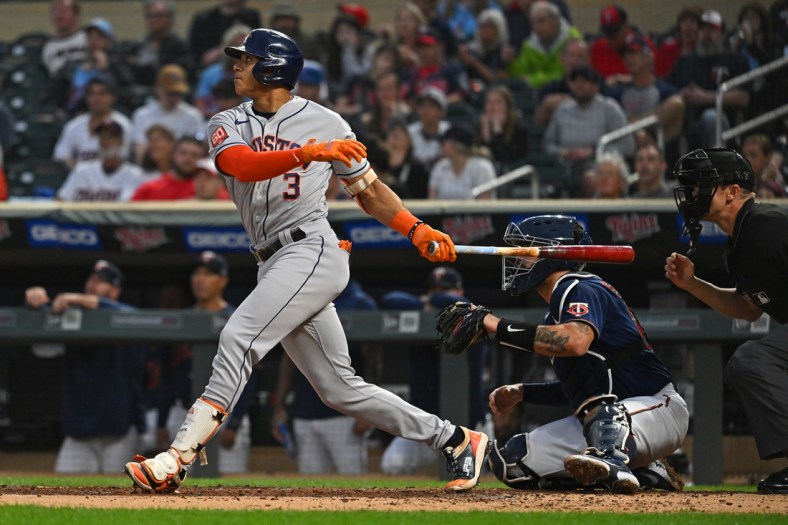 May 11, 2022; Minneapolis, Minnesota, USA;  Houston Astros shortstop Jeremy Pena (3) drives in a run on a sacrifice fly against the Minnesota Twins during the second inning at Target Field. Mandatory Credit: Nick Wosika-USA TODAY Sports