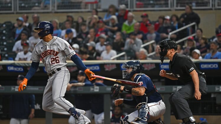 May 11, 2022; Minneapolis, Minnesota, USA;  Houston Astros center fielder Jose Siri (26) hits an RBI single against the Minnesota Twins during the second inning at Target Field. Mandatory Credit: Nick Wosika-USA TODAY Sports
